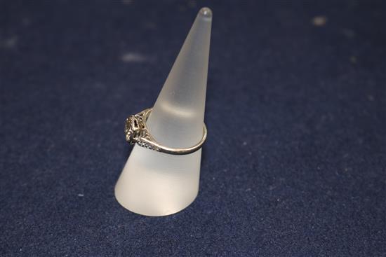 A diamond solitaire ring, the old-cut diamond approx 1.0ct, with diamond-set shoulders on white gold shank, size O.